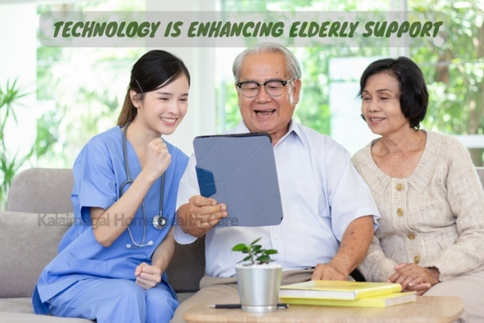 Nurse using a tablet to assist an elderly couple, demonstrating how Kalaimagal Home Health Care in Coimbatore is utilizing technology to enhance elderly support