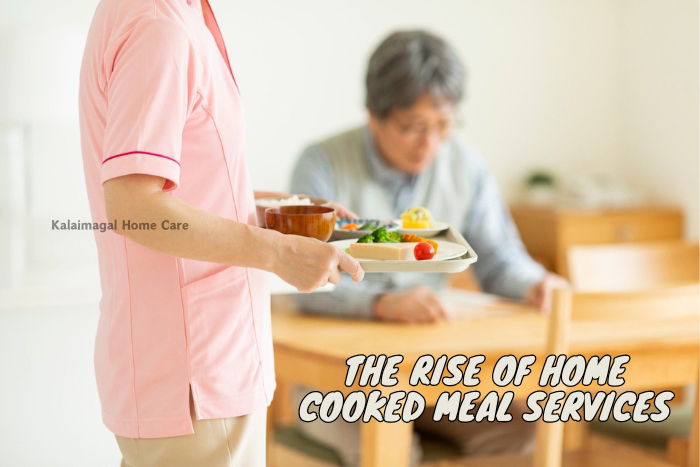 Caregiver serving a nutritious home-cooked meal to an elderly resident, highlighting the personalized home cooking services by Kalaimagal Home Care in Coimbatore
